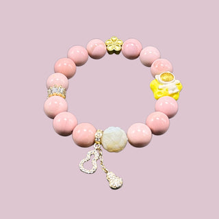 Sweetheart Symphony: Opaque Pink Beaded Bracelet with Multiple Stylish Charms - front view