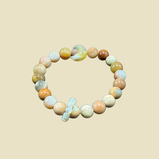 Heartfelt Drift: Small Beaded Bracelet with Moon Gemstone and Tiny Ring Charm - front view
