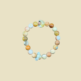 Heartfelt Drift: Small Beaded Bracelet with Moon Gemstone and Tiny Ring Charm - high angle
