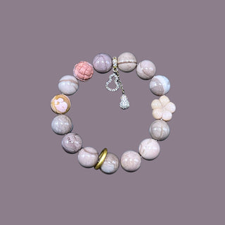 PetalPulse: Sakura Ash Pink Beaded Stretch Bracelet with 14k Gold Pendants - high angle